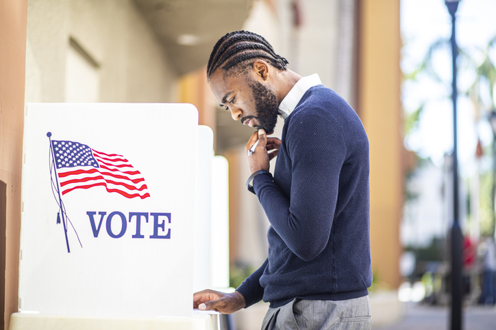 Millenial Black Man Voting in Election